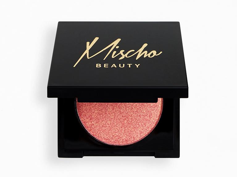 Mischo Beauty Blush in Magnifique - Silky, smooth, and highly pigmented superfine powder blush in a soft-coral pink with gold sheen color. 